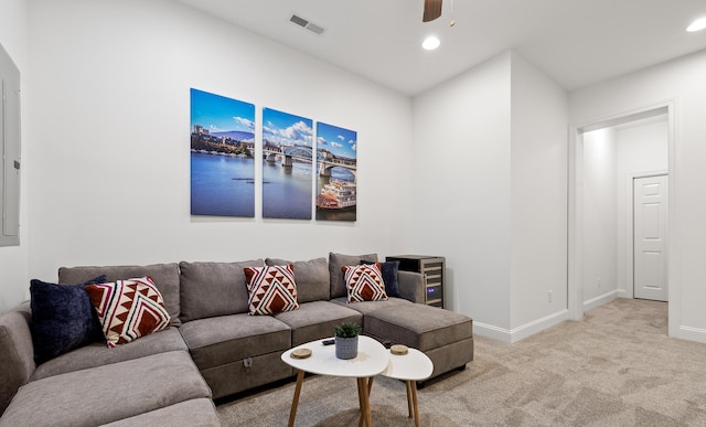 living room with ceiling fan and light carpet