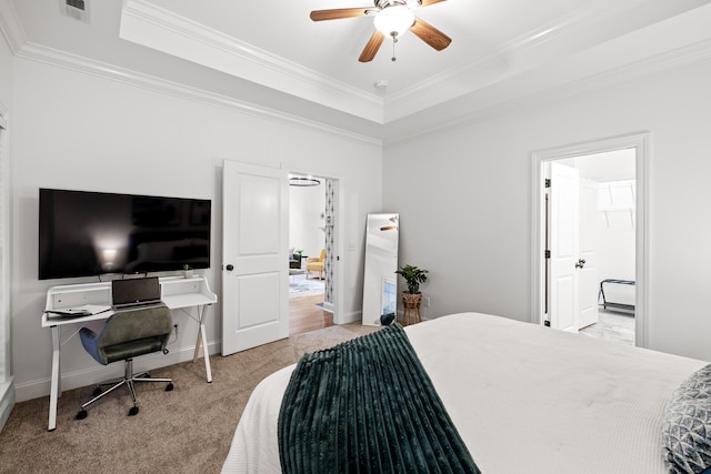 bedroom with a tray ceiling, ceiling fan, crown molding, and light carpet