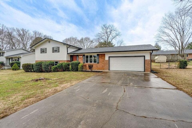 split level home with a garage and a front lawn