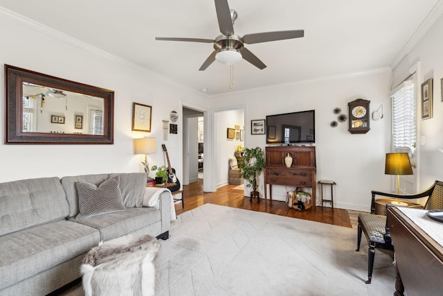 living room featuring crown molding, ceiling fan, and hardwood / wood-style flooring