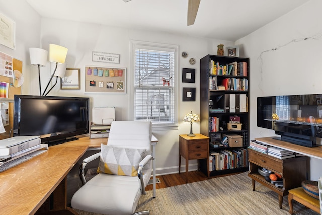 office with ceiling fan and hardwood / wood-style flooring