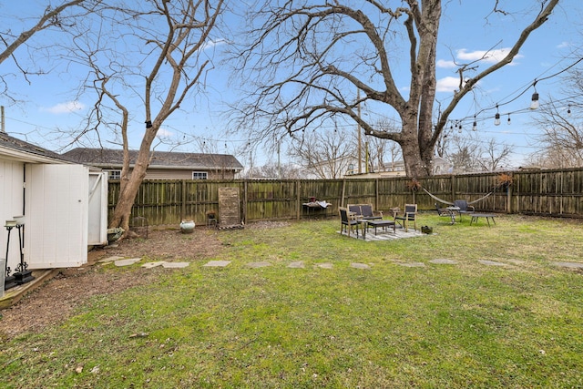 view of yard with a fire pit