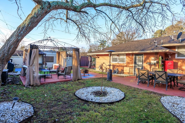 view of yard featuring a gazebo, a patio area, and an outdoor living space