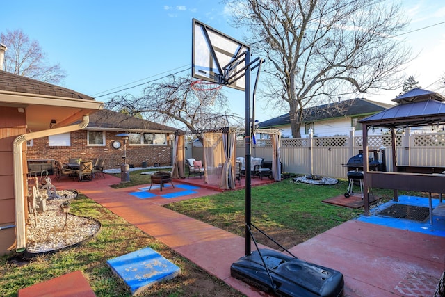 view of patio / terrace featuring a gazebo and grilling area