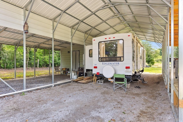 view of vehicle parking featuring a carport