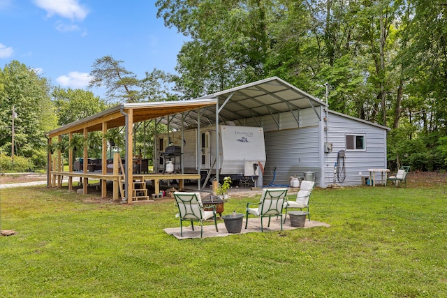 exterior space with a lawn and a carport