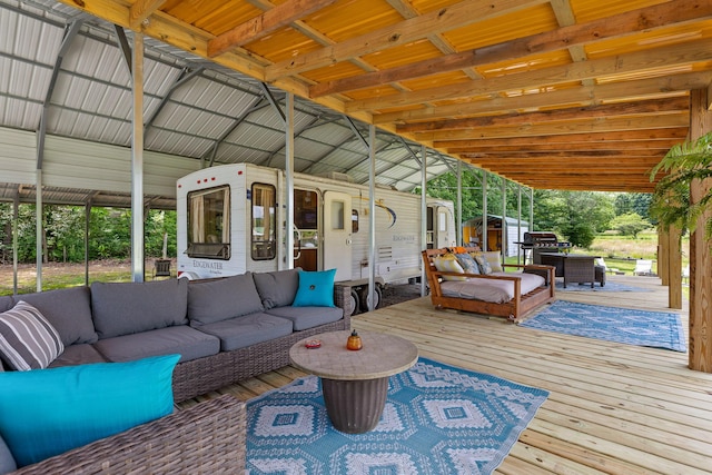 wooden terrace featuring an outdoor hangout area