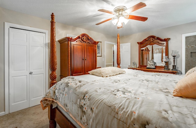 carpeted bedroom featuring connected bathroom, ceiling fan, and a textured ceiling