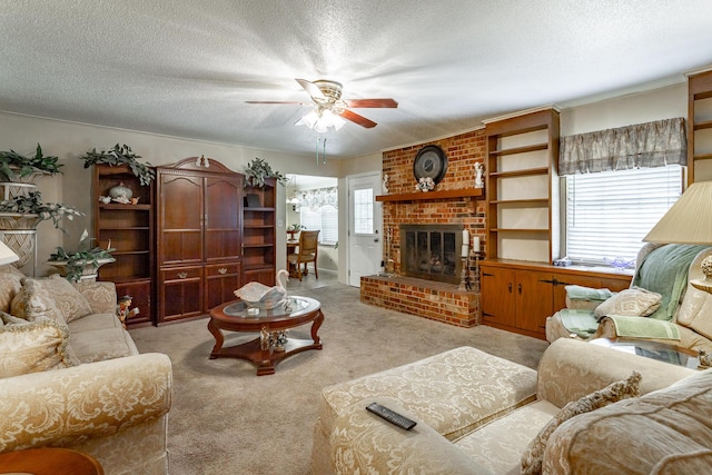 carpeted living room with ceiling fan, a textured ceiling, and a brick fireplace