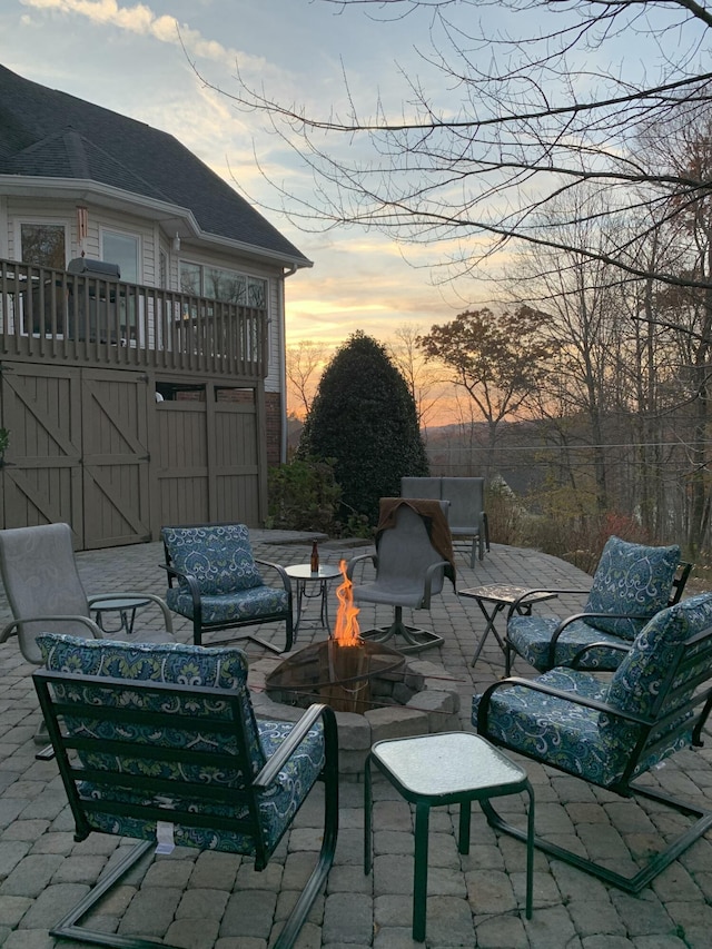 patio terrace at dusk with an outdoor fire pit