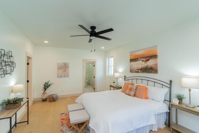 bedroom featuring light hardwood / wood-style flooring and ceiling fan