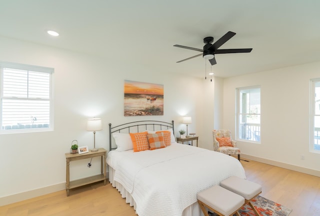 bedroom featuring light wood-type flooring and ceiling fan