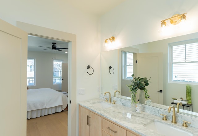 bathroom featuring hardwood / wood-style flooring, plenty of natural light, and ceiling fan