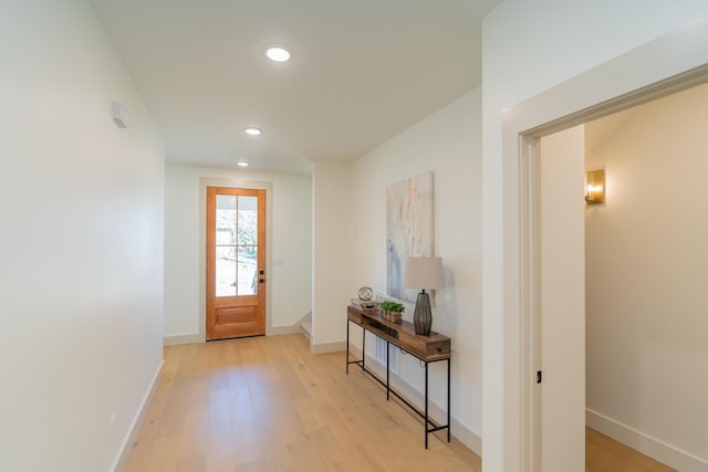 doorway with light hardwood / wood-style floors