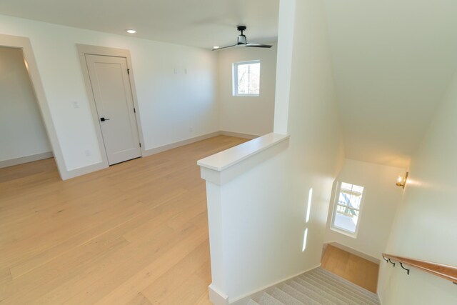 spare room with ceiling fan and light hardwood / wood-style flooring