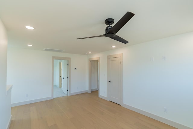 unfurnished room featuring light hardwood / wood-style floors and ceiling fan