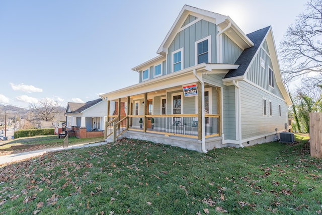 view of front of home with a porch, central air condition unit, and a front lawn