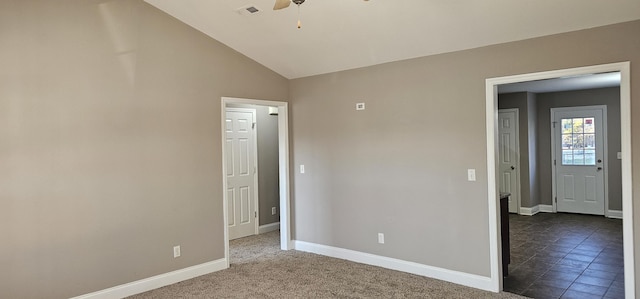 unfurnished bedroom featuring a ceiling fan, lofted ceiling, baseboards, and visible vents