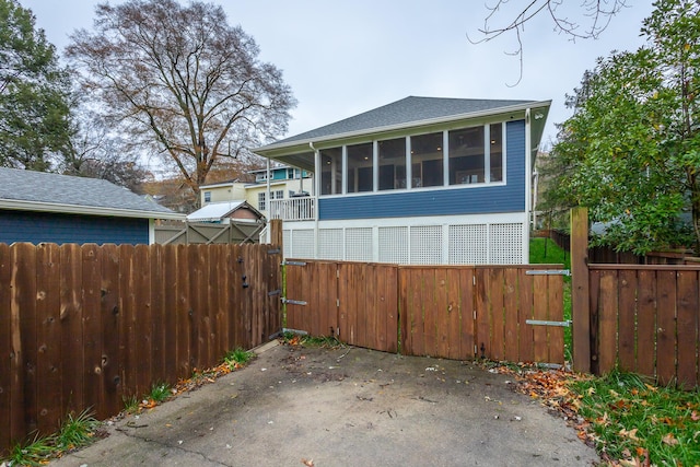 view of side of home with a sunroom