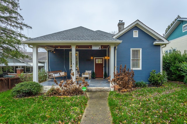 view of front of property with an outdoor hangout area and a front lawn