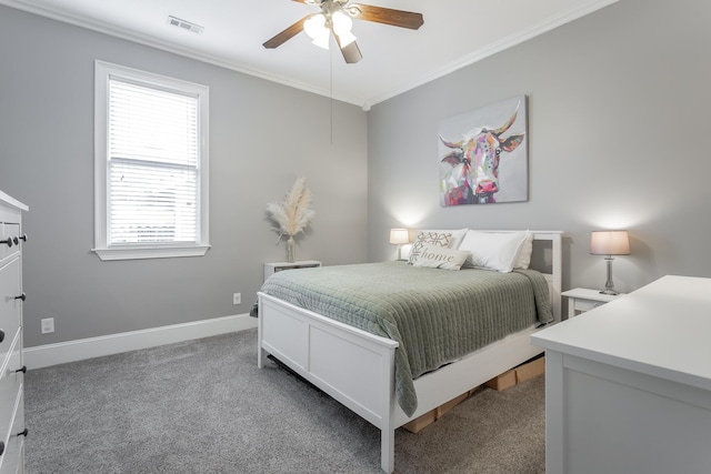 bedroom featuring ceiling fan, crown molding, and dark carpet