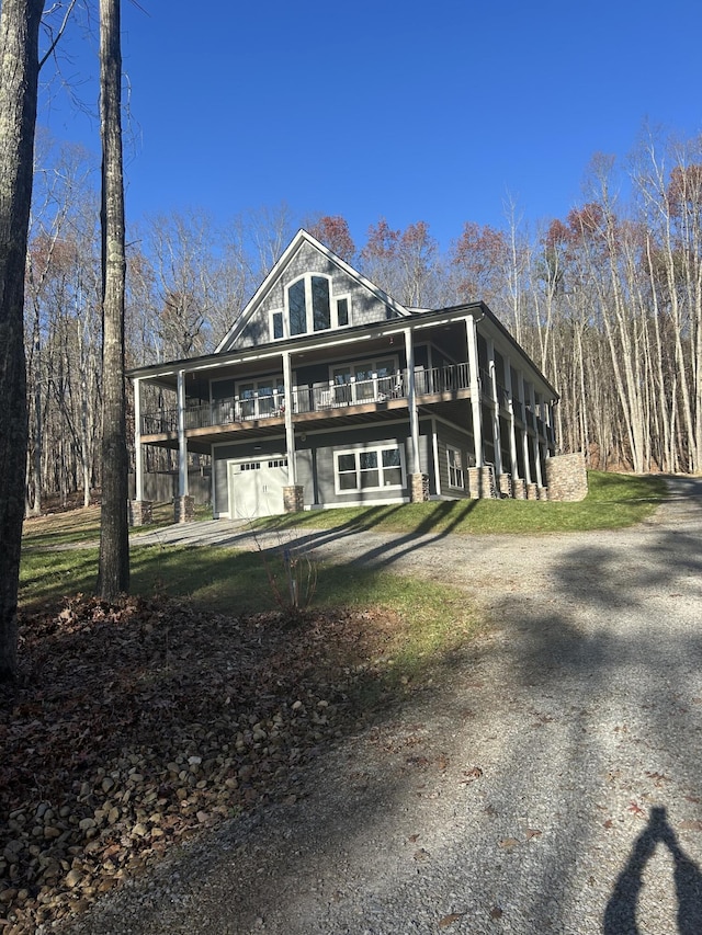 back of house featuring a garage