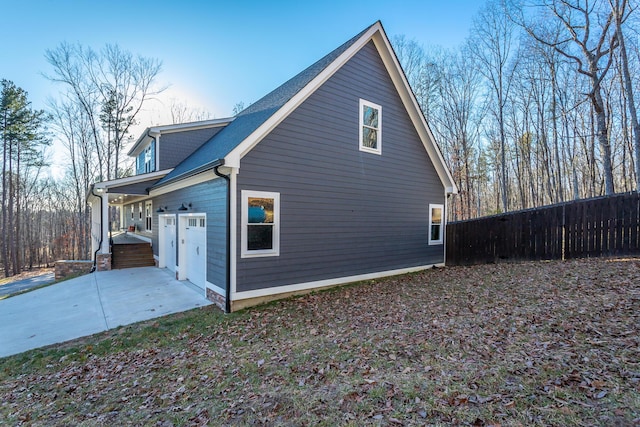 view of side of home with a garage