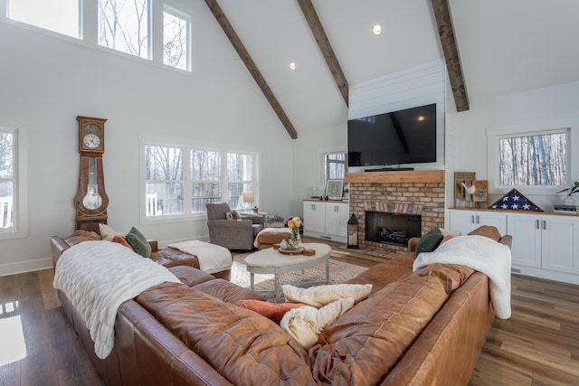 living room with a fireplace, dark wood-type flooring, high vaulted ceiling, and beamed ceiling