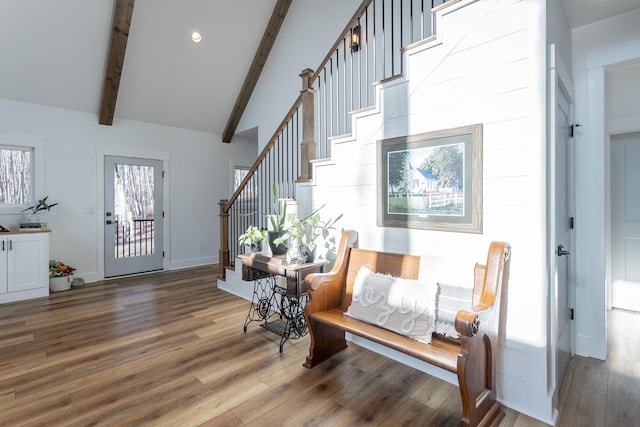 foyer entrance with hardwood / wood-style flooring, high vaulted ceiling, and beamed ceiling