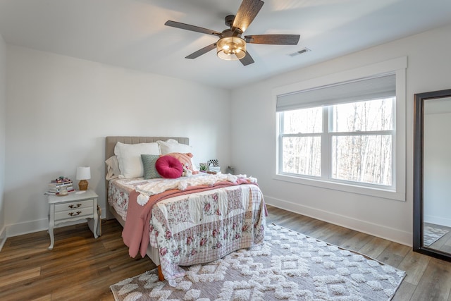 bedroom featuring dark hardwood / wood-style floors and ceiling fan