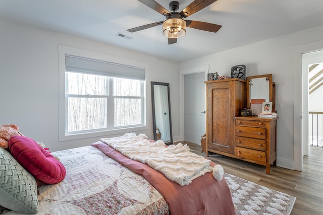 bedroom featuring ceiling fan and light wood-type flooring