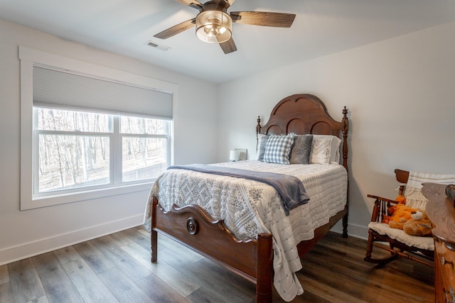 bedroom with dark wood-type flooring and ceiling fan