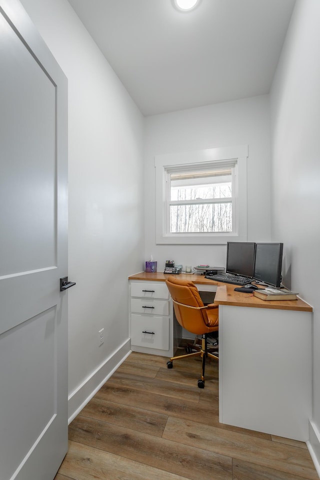 home office featuring hardwood / wood-style flooring