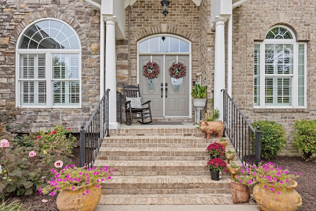 property entrance with brick siding