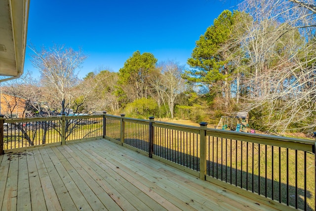 wooden terrace featuring a playground