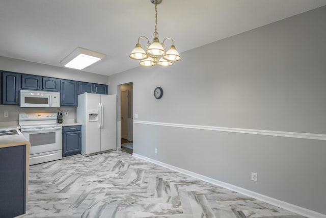 kitchen featuring white appliances, sink, blue cabinetry, decorative light fixtures, and a chandelier