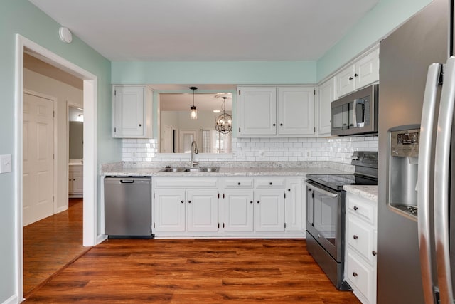 kitchen featuring sink, white cabinets, and appliances with stainless steel finishes