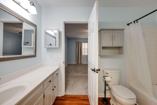 full bathroom with shower / tub combo, vanity, toilet, and wood-type flooring