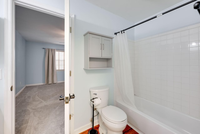 bathroom with shower / bath combo and toilet