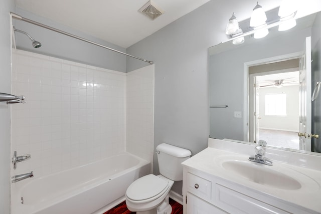 full bathroom featuring vanity, ceiling fan, toilet, and bathtub / shower combination