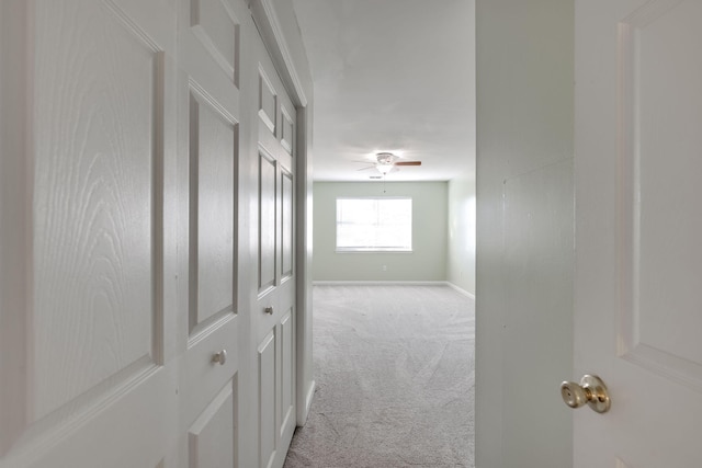 corridor with light colored carpet