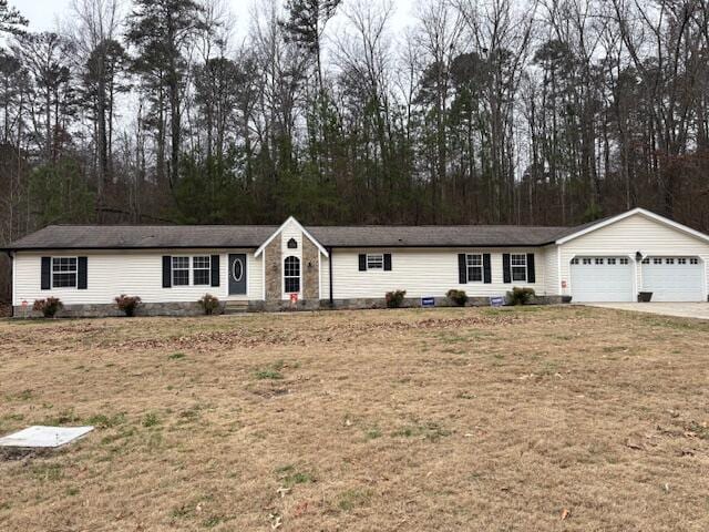 single story home with a front yard and a garage