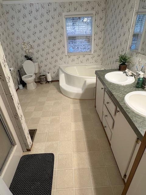 full bathroom featuring tile patterned flooring, vanity, separate shower and tub, and toilet