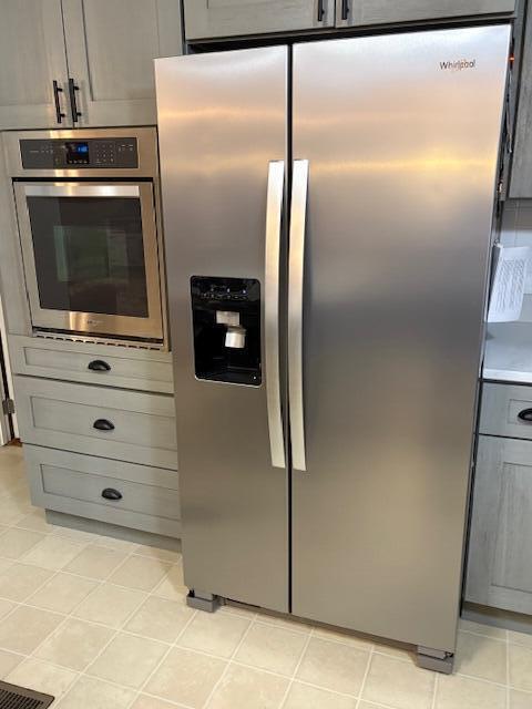 kitchen featuring gray cabinets and stainless steel appliances