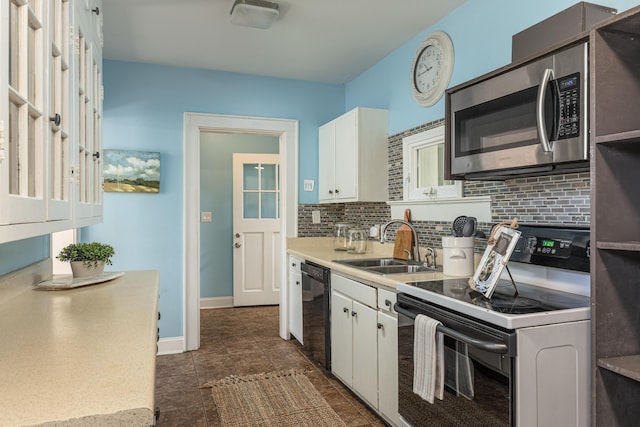 kitchen with electric range, sink, white cabinetry, and black dishwasher