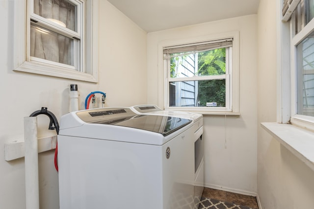 laundry area featuring washing machine and clothes dryer