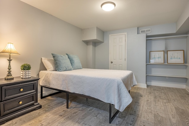 bedroom with light wood-type flooring