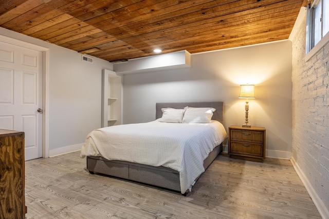 bedroom featuring wooden ceiling and light hardwood / wood-style floors