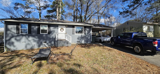 single story home with a carport