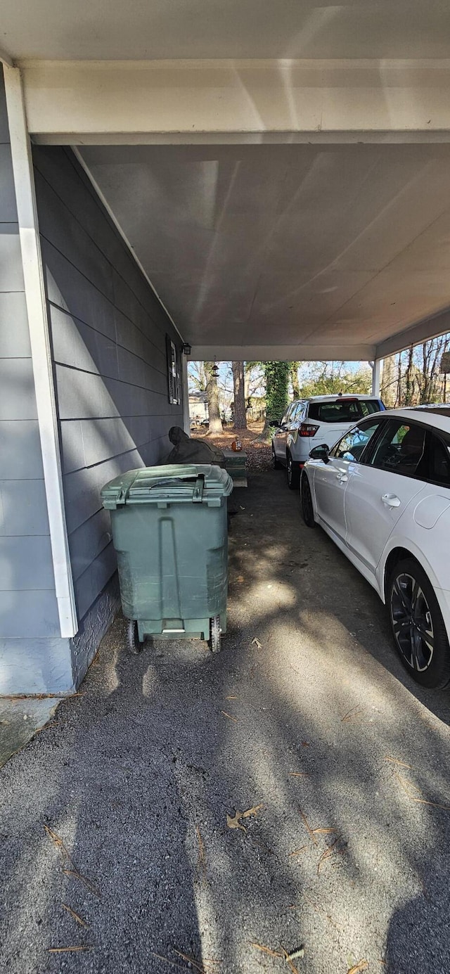 view of vehicle parking featuring a carport